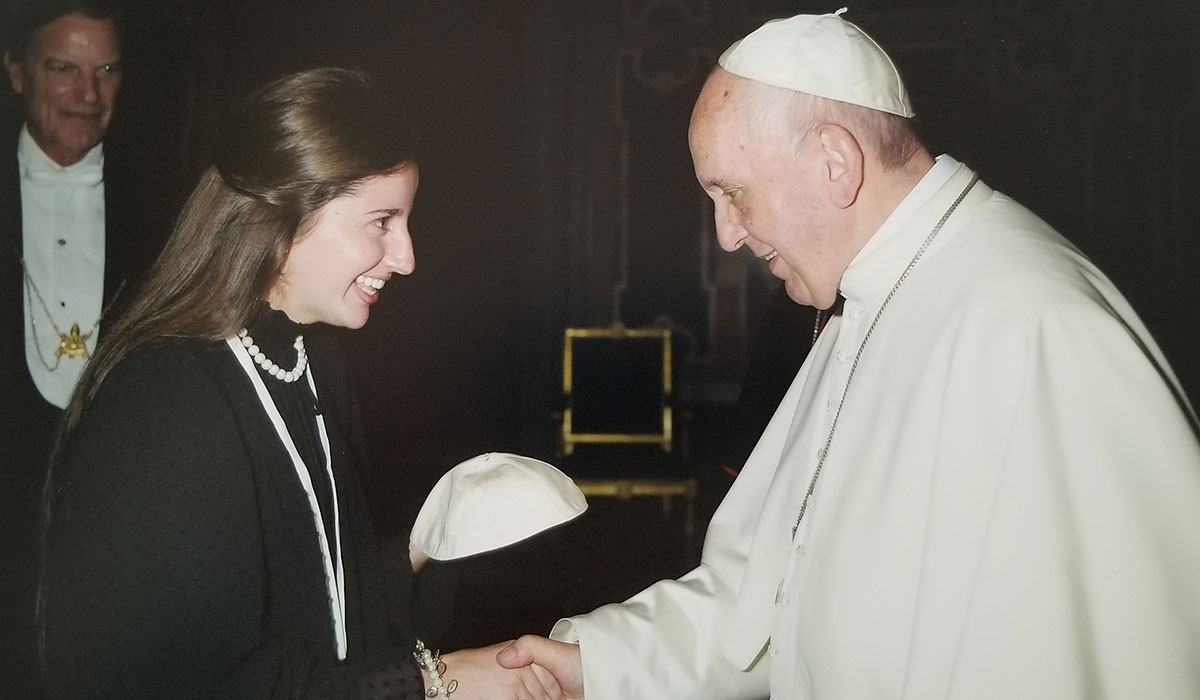 Student receiving gift from the Pope